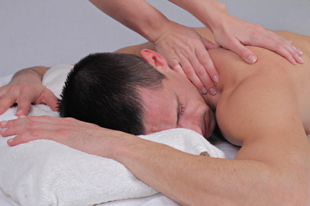 Man having massage. Relaxation, body care treatment, spa, wellness concept - Fotó, kép