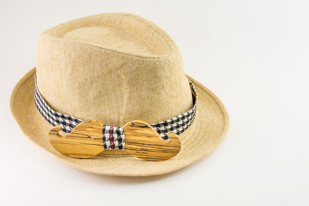 Wooden bow tie around a hat. - Photo, Image