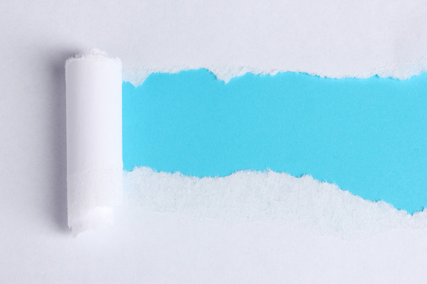 Torn paper with blue background - Fotoğraf, Görsel