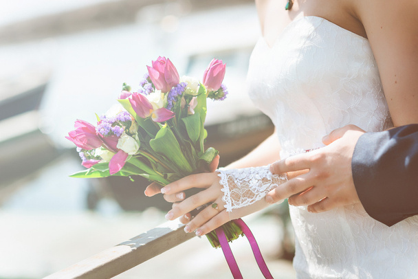 Wedding bouquet, white, pink, purple flowers. In the hands of  bride. - 写真・画像