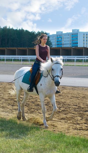 Girl astride a horse - Fotoğraf, Görsel