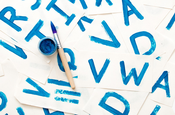 Alphabet drawing. Process of creating watercolor font. - 写真・画像