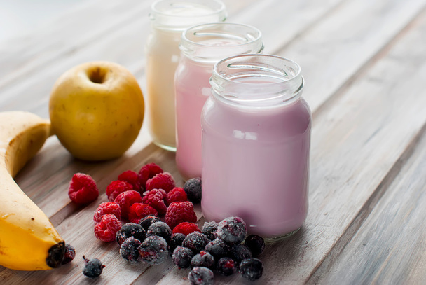 Healthy yogurts with mix of berries  - Фото, зображення