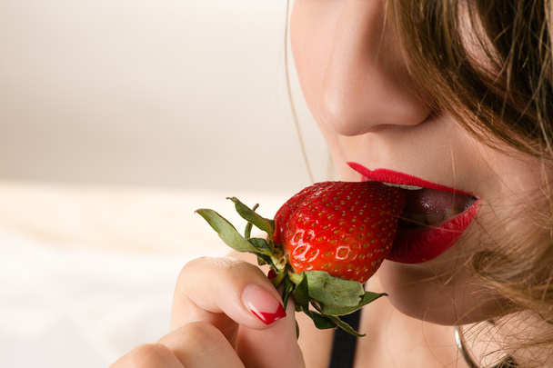 sensual woman eating strawberry - Photo, Image