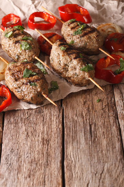Tasty Kofta kebab with grilled vegetables close-up on the table. - Photo, Image