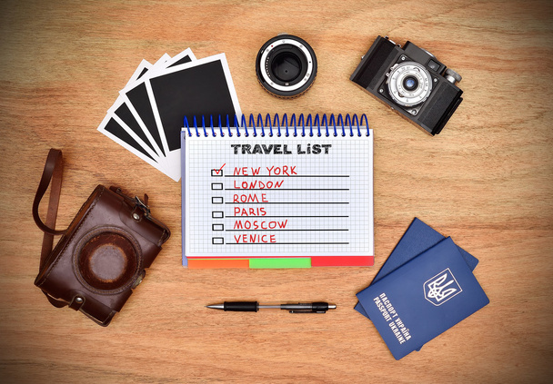 Camera, passport, pen and note pad with drawing travel list. Work desk tourist. - Fotoğraf, Görsel