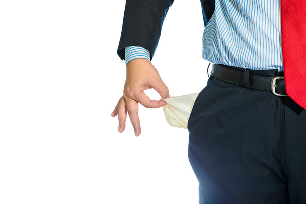 Businessman Pulling out Empty Pocket Isolated on white - 写真・画像