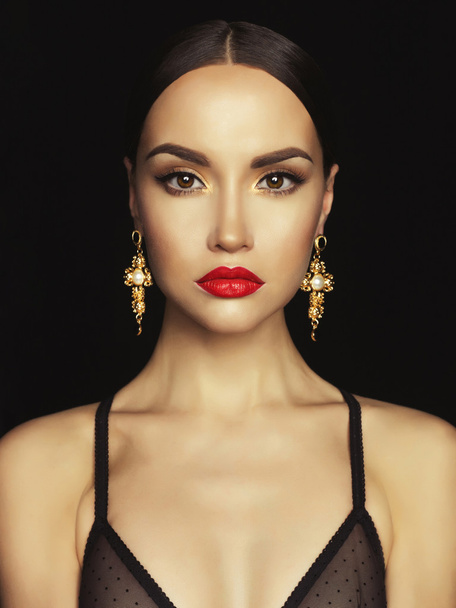 Beautiful lady with earring on black background - Foto, Imagem