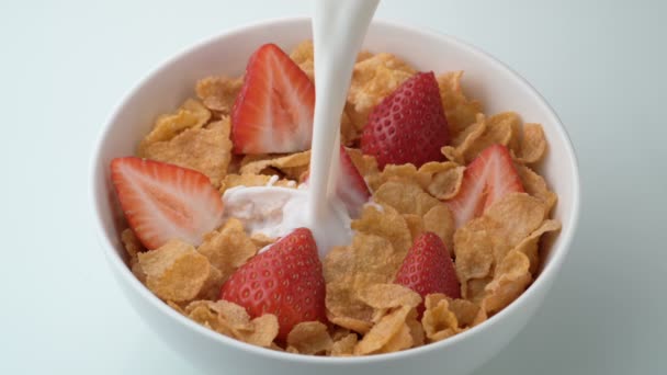 Corn flakes pouring with milk - Footage, Video