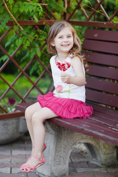 Cute child with lollipop - Foto, afbeelding