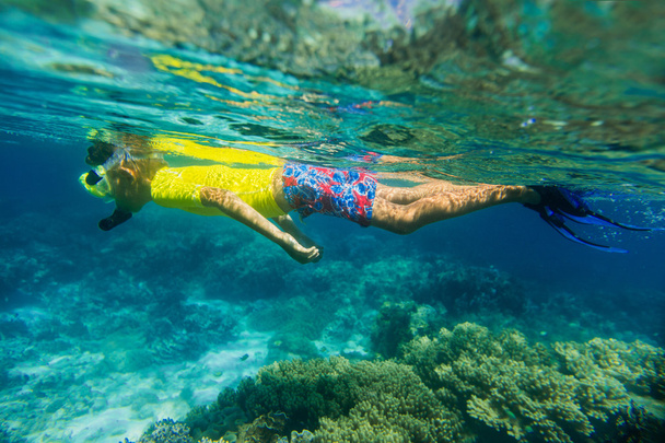Boy dives in a tropical sea - Фото, зображення