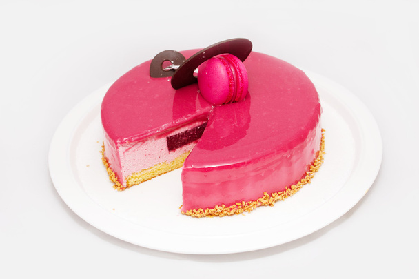 Pink cake with a chocolate and zephyr on white plate - Foto, imagen