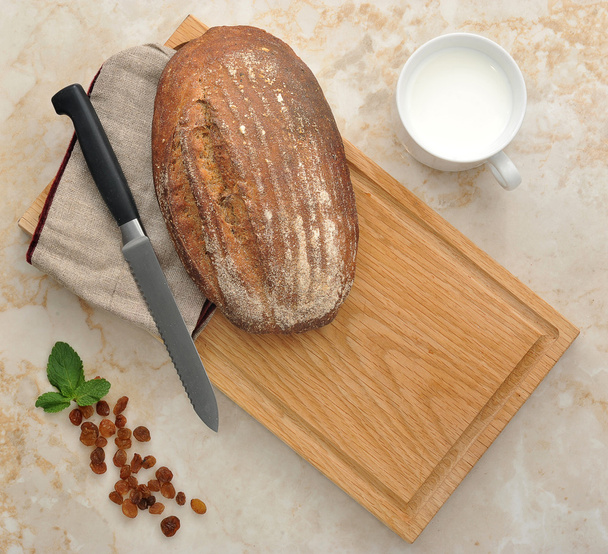 black bread on wooden background. top view - Fotografie, Obrázek