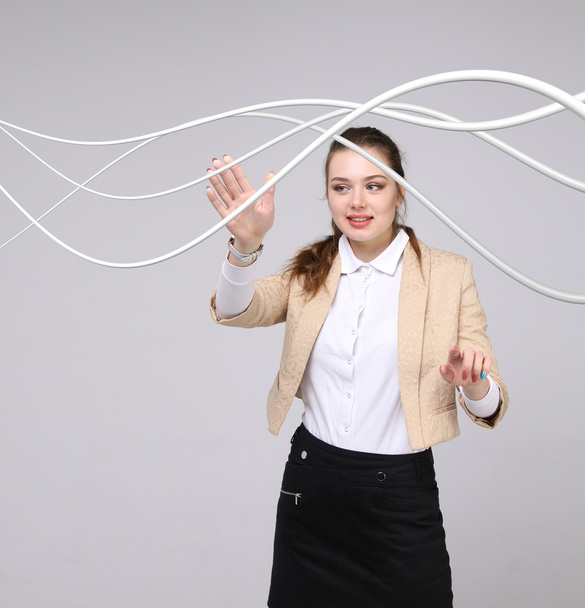 Woman with electrical cables or wires, curved lines - Foto, immagini