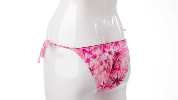 Pink swimsuit bottom on mannequin. - Footage, Video