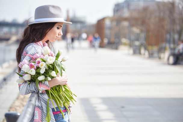 woman with bouquet of tulips  - Foto, Bild