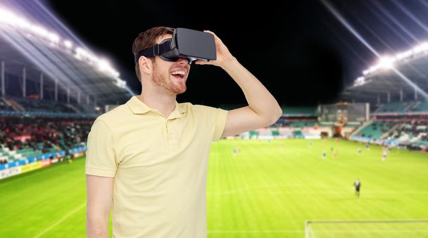 man in virtual reality headset over football field - Fotó, kép
