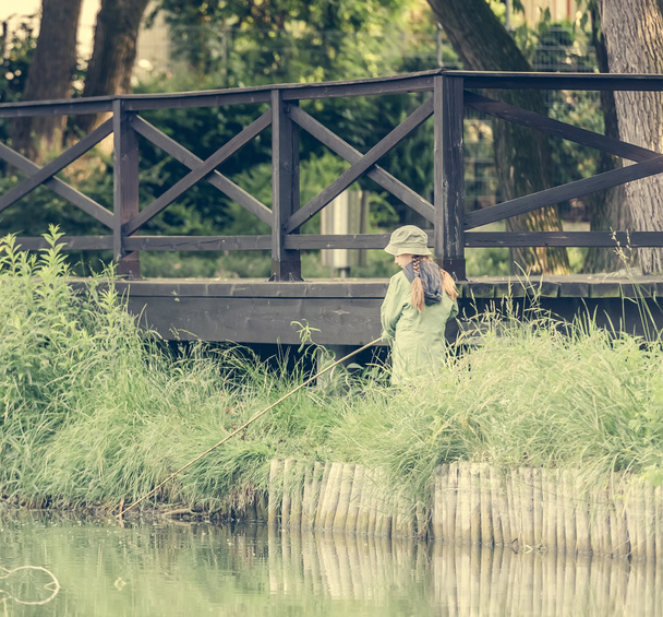 little fisher girl holding a rod - Φωτογραφία, εικόνα