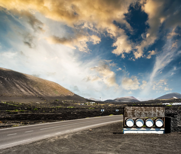 road and restaurant advertisement casks near mountains - Photo, Image