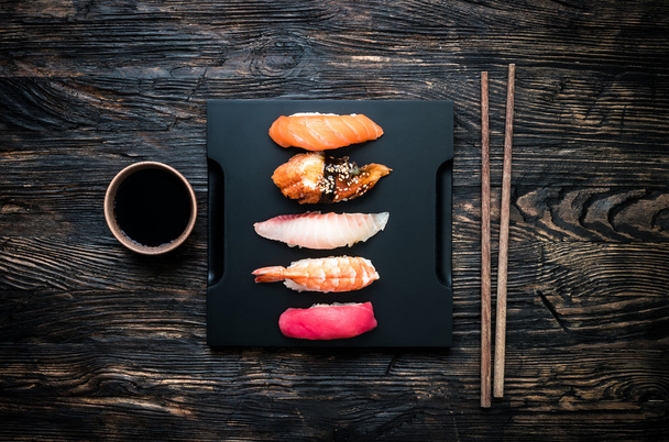 set of sashimi sushi with soy and chopsticks - Foto, immagini