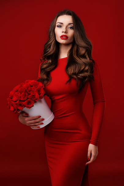 lady in red with roses - Zdjęcie, obraz
