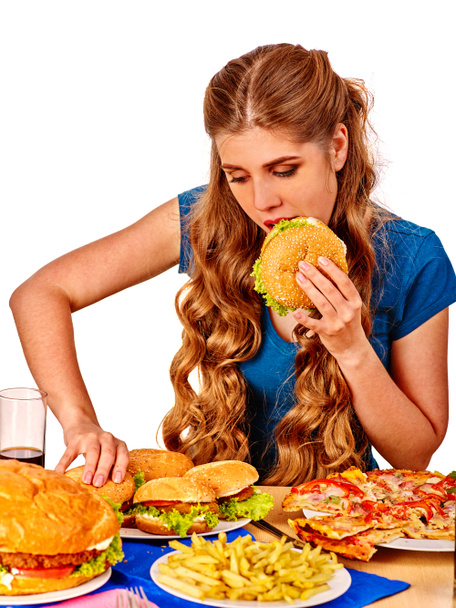Beautiful girl eats hamburgers. - Photo, Image