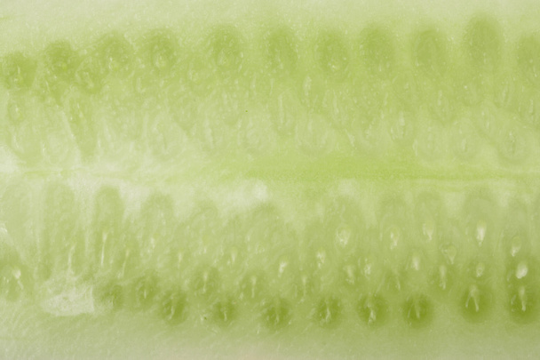 section of cucumber as a background close-up macro - Foto, afbeelding