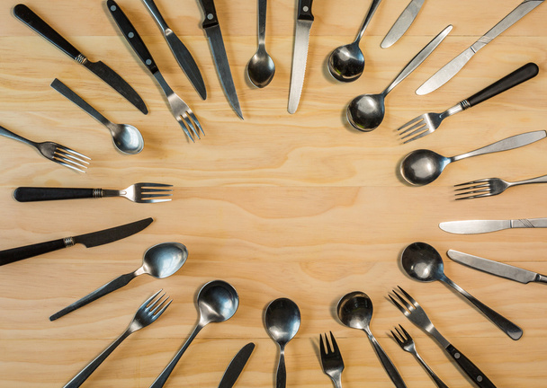  cutlery background on wooden table - Fotoğraf, Görsel