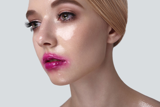 Beauty Model with wet Makeup on Skin - Фото, изображение