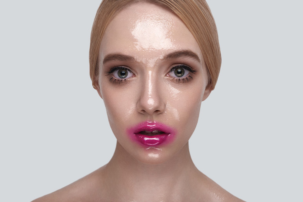 Surprised Woman with wet Skin and pink Lips - Фото, изображение