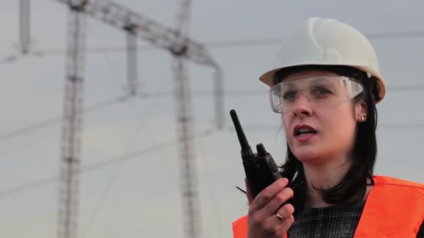 Electrical distribution engineer talking on a walkie- talkie - Footage, Video
