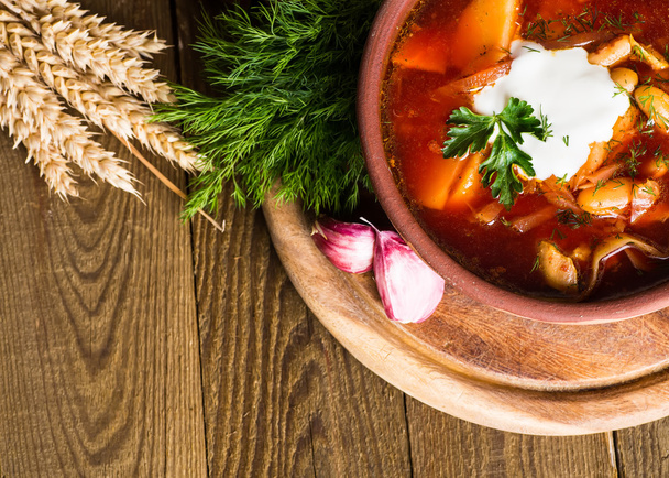 Ukrainian beetroot soup - borscht, on napkin, on wooden backgrou - Valokuva, kuva