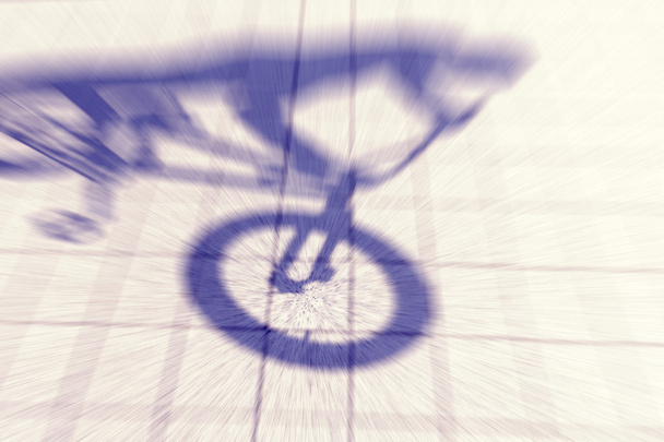 Retro toned motion blurred shadow of a teenager riding a bmx bik - Photo, Image