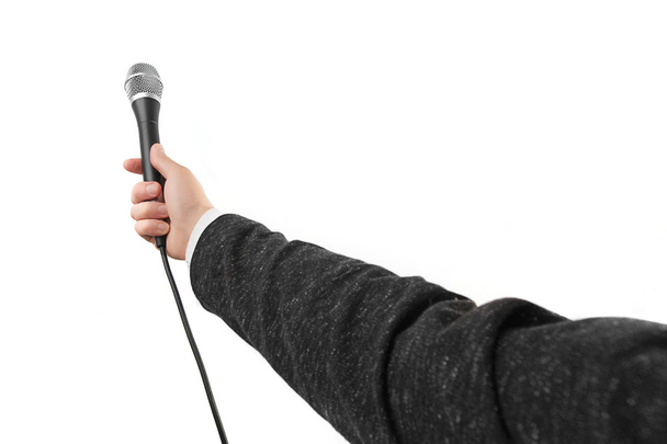   A man holding a microphone in his hand - Фото, зображення