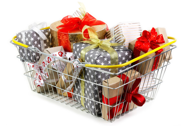 Shopping basket filled with gifts up to the top - 写真・画像