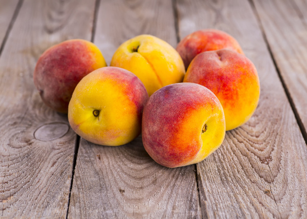 fresh peaches on wood background - 写真・画像