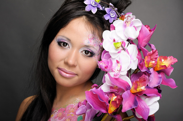 Close-up portrait of asian girl with flowers - Fotoğraf, Görsel