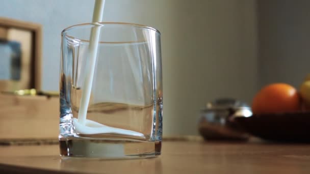 Pouring milk into glass in slowmotion - Footage, Video