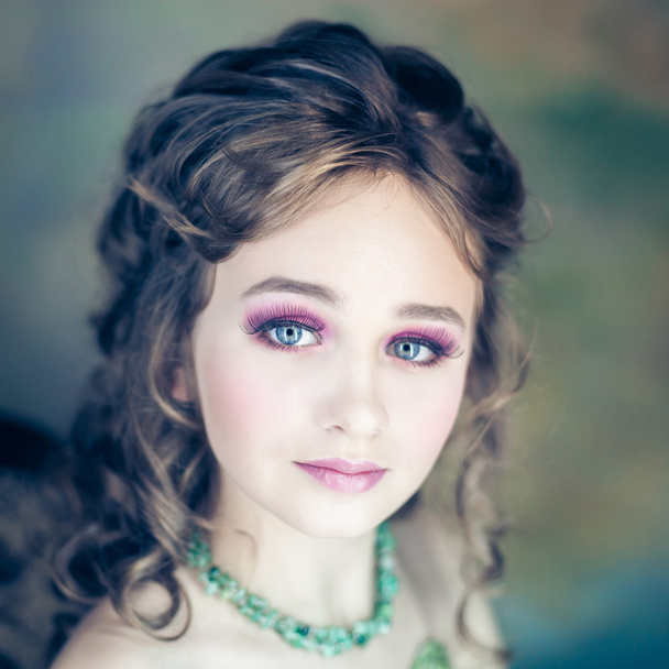 Little girl with beautiful makeup - Fotó, kép