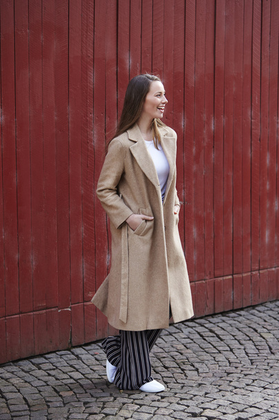 Beautiful young woman in long coat - Valokuva, kuva