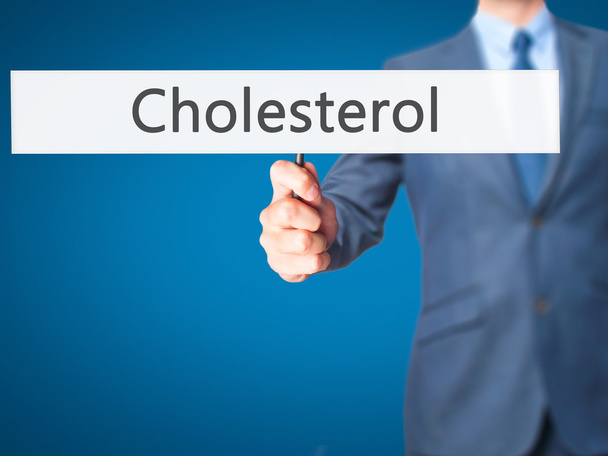 Colesterol - Empresario mano sosteniendo signo
 - Foto, Imagen