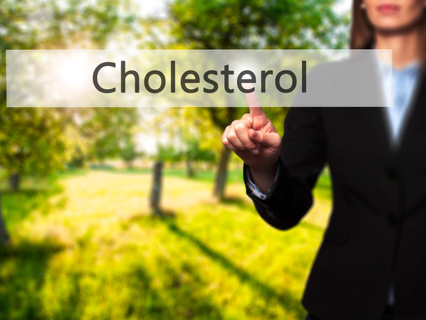 Cholesterol - Businesswoman hand pressing button on touch screen - Photo, Image