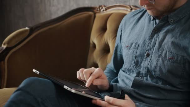 Portrait Of A Handsome Young Happy Man Using Digital Tablet - Video, Çekim