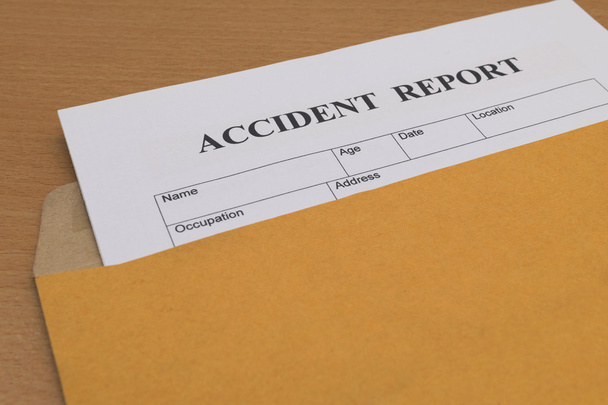 Accident report form on brown envelope  - Foto, Imagem