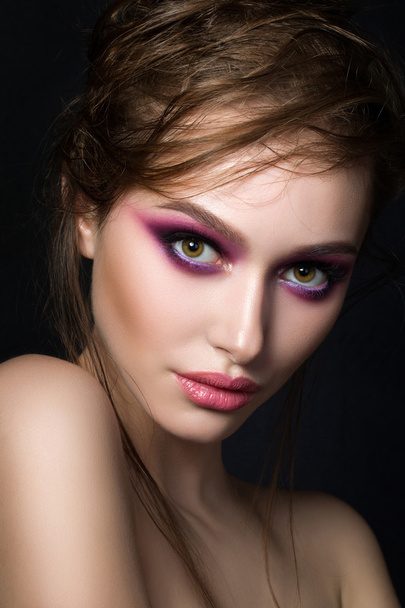Closeup portrait of young beautiful woman with bright pink smoke - Fotografie, Obrázek