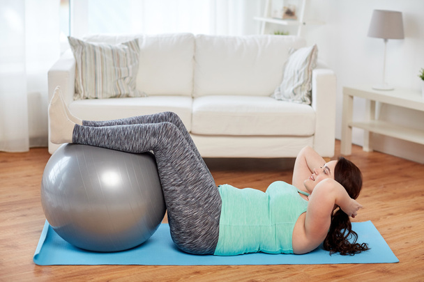 plus size woman exercising with fitness ball - Fotoğraf, Görsel