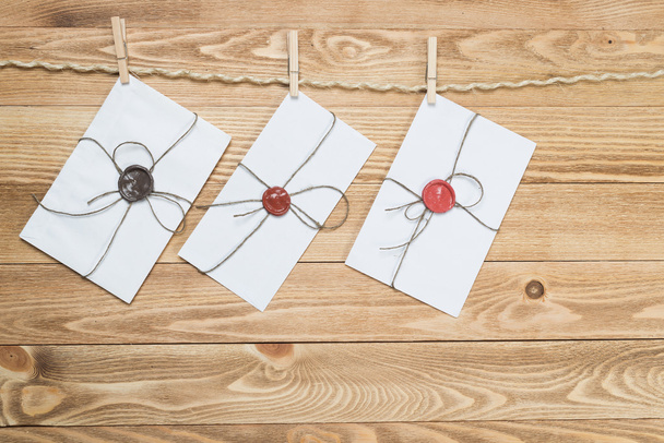 Envelopes hanging on ropes  - Foto, imagen