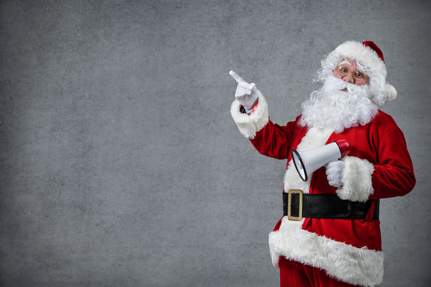 Santa Claus señalando en blanco
 - Foto, Imagen