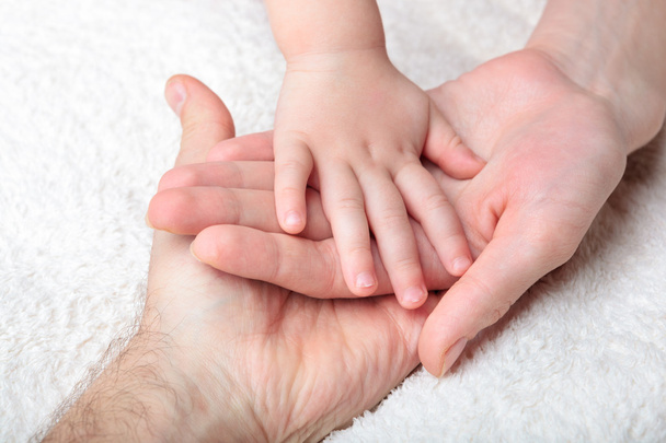 Closeup of baby, mother and father hands - Φωτογραφία, εικόνα