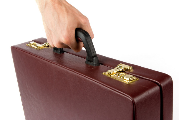 Hand holding a briefcase - Foto, afbeelding